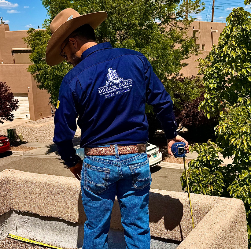 roofer taking meassures of roof