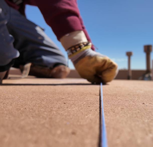 roofing working on flat roof