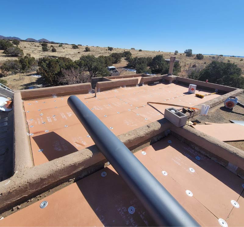 Roof Inspection 3 New TPO flat roofing system installed on a Santa Fe, NM property with mountain views